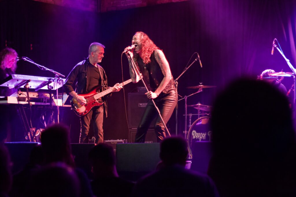 Deeper Purple performing live at The Brook Southampton with singer and bassist interacting on stage