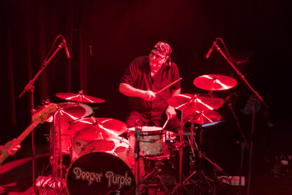 Drummer performing live with Deeper Purple on stage