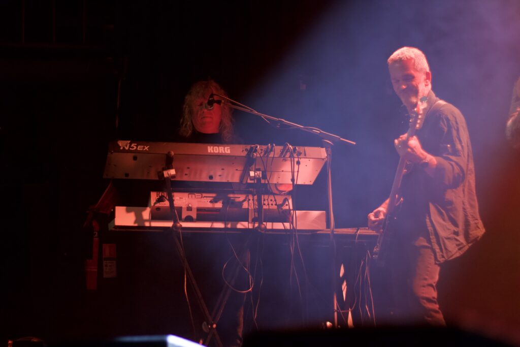 Keyboard player and bass player of Deeper Purple performing together under red stage lighting at The Brook Southampton