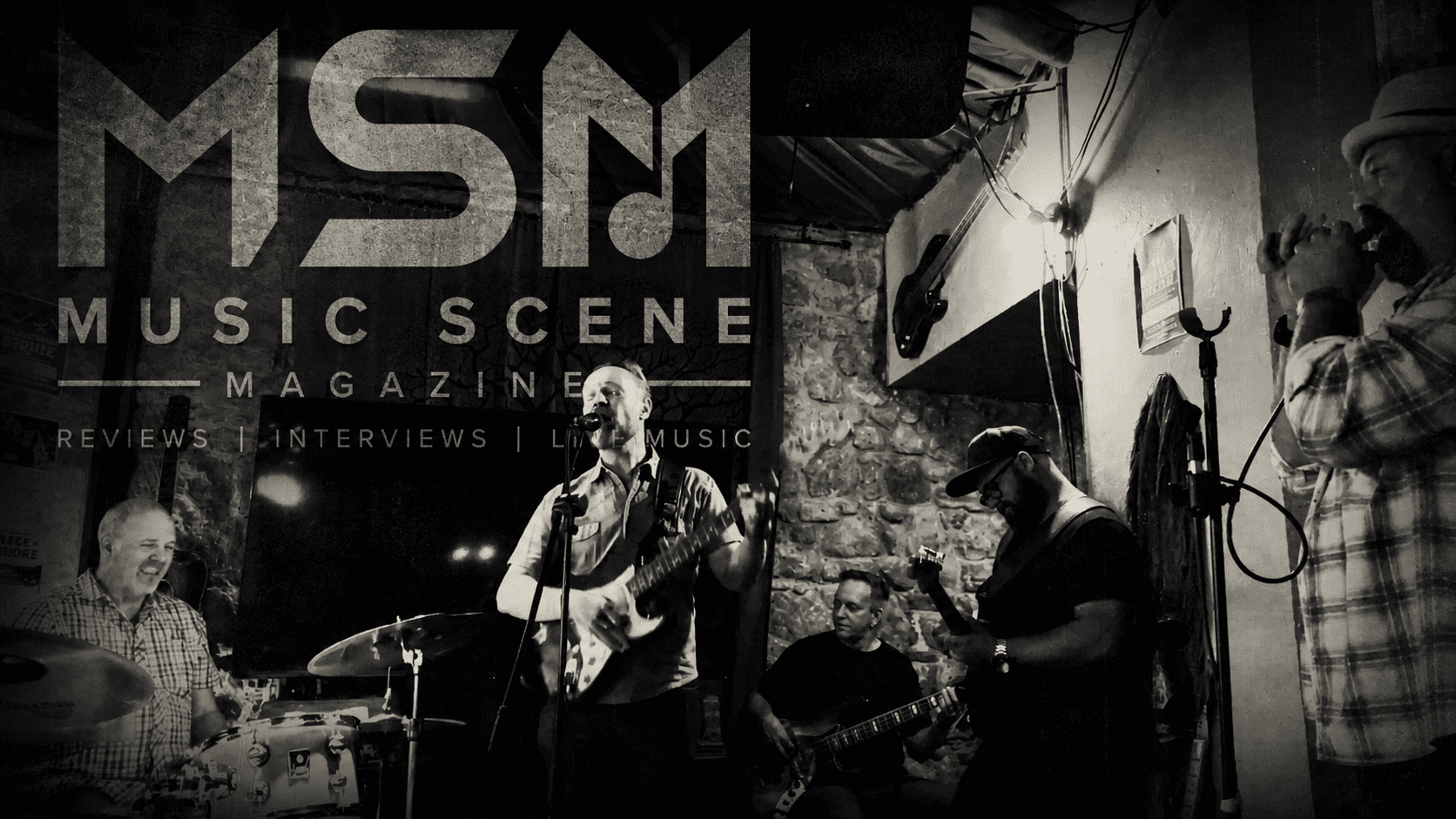Black and white live music performance image with MSM Music Scene Magazine branding