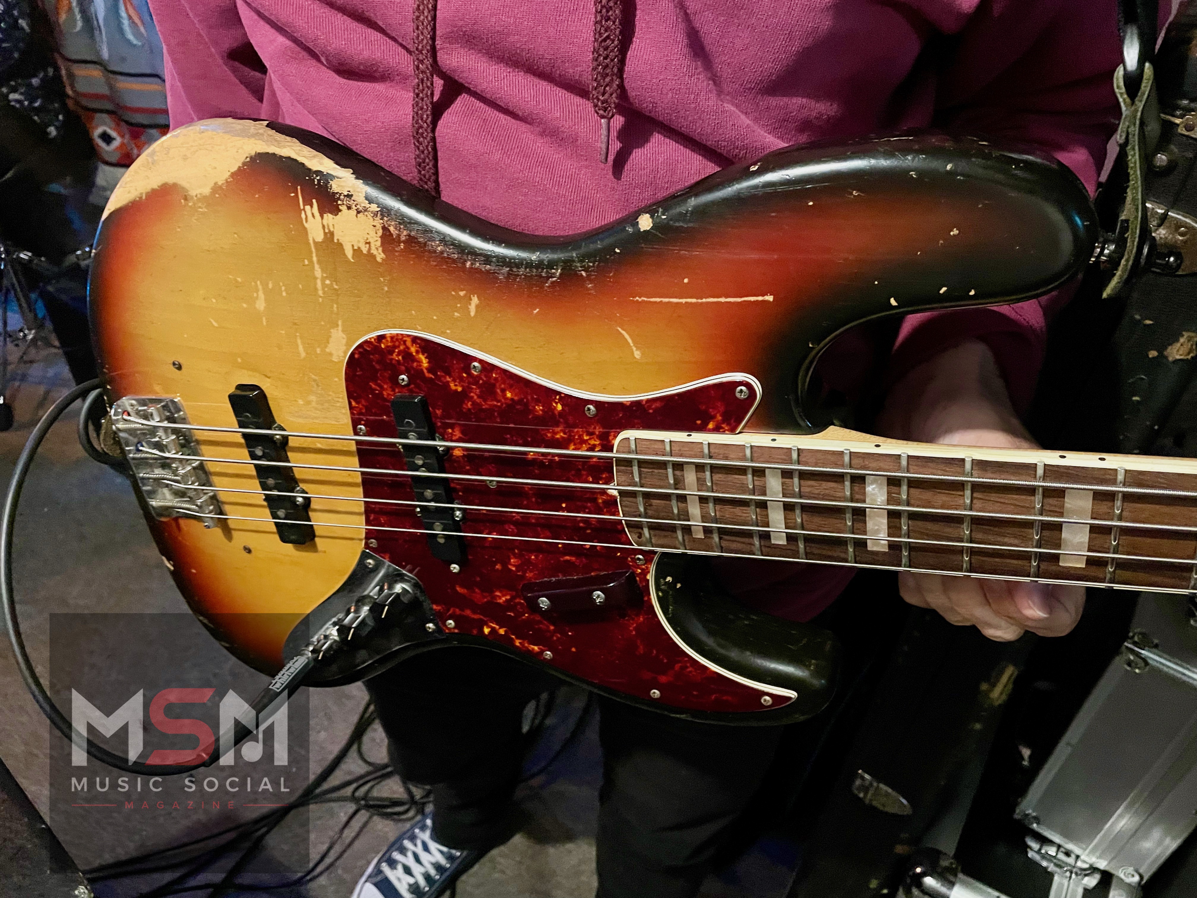 Close-up detail of Rob Marshall’s worn 1972 Fender Jazz Bass during The Blues Social at The Platform Tavern in Southampton, showing the heavily played sunburst finish and vintage character of the instrument.