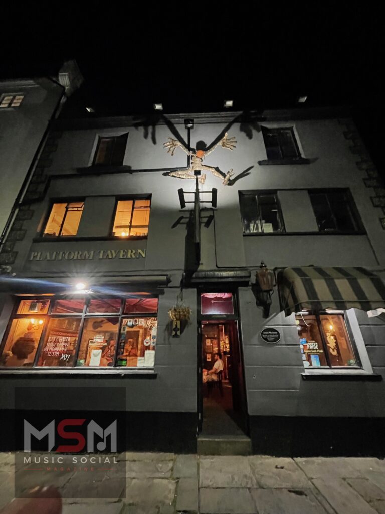Exterior night view of The Platform Tavern in Southampton during The Blues Social live music evening, featuring the historic dockside pub illuminated beneath Southampton’s medieval town walls.