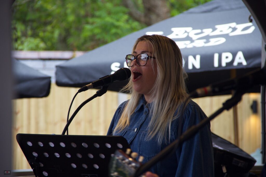 Female vocalist performing live with Supersonic Spirit at Brew Fest in Botley.