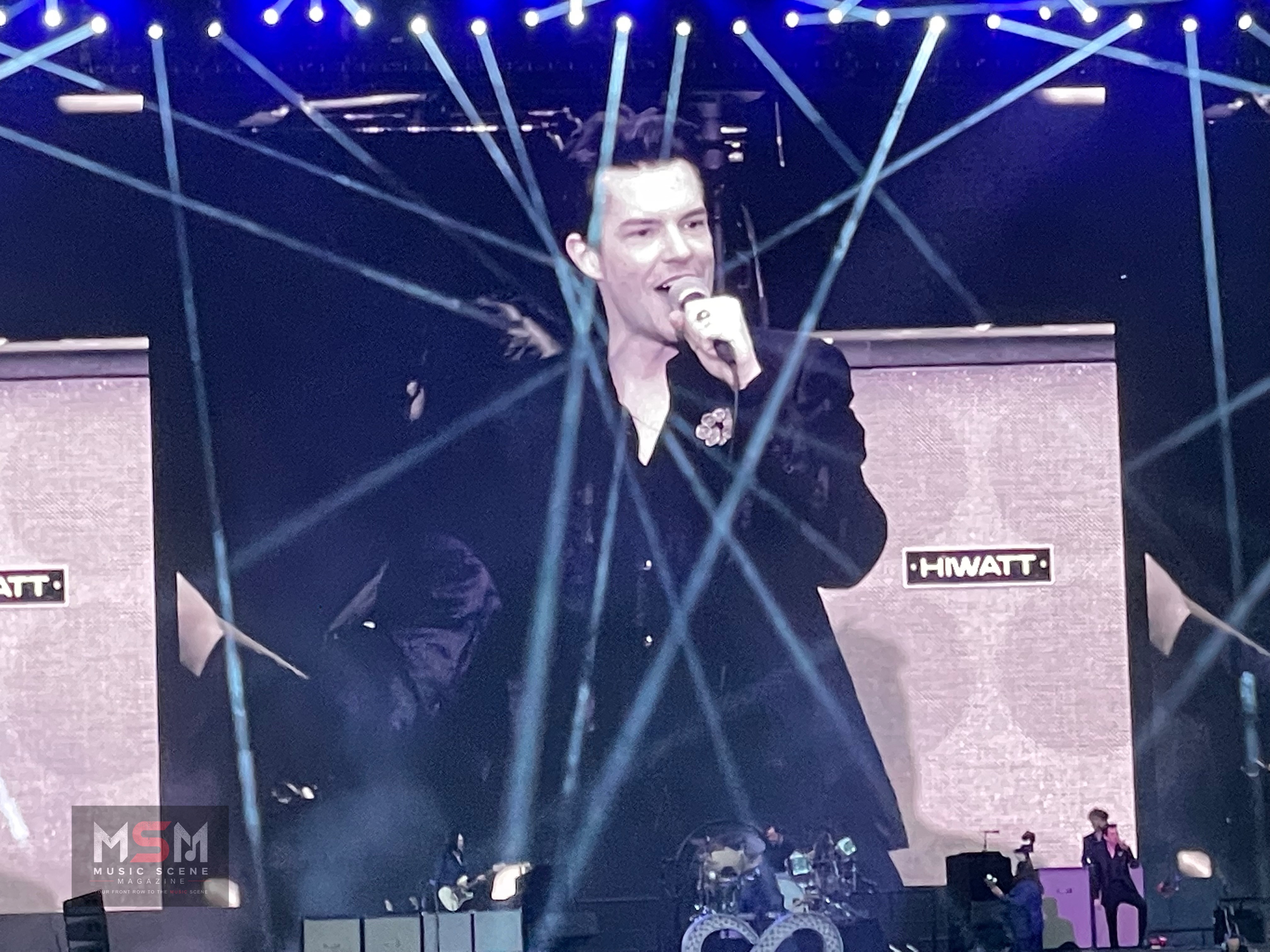 Brandon Flowers performing live at St Mary’s Stadium in front of a large crowd during a major arena concert performance.