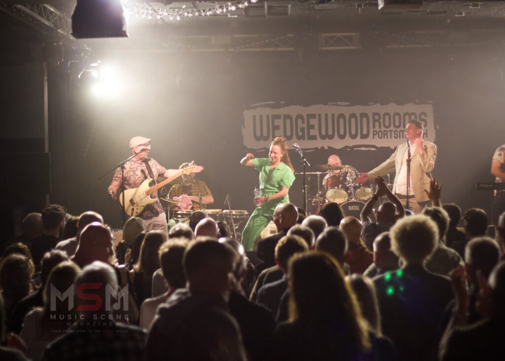 Live band performance with audience during Speaking In Tongues show.
