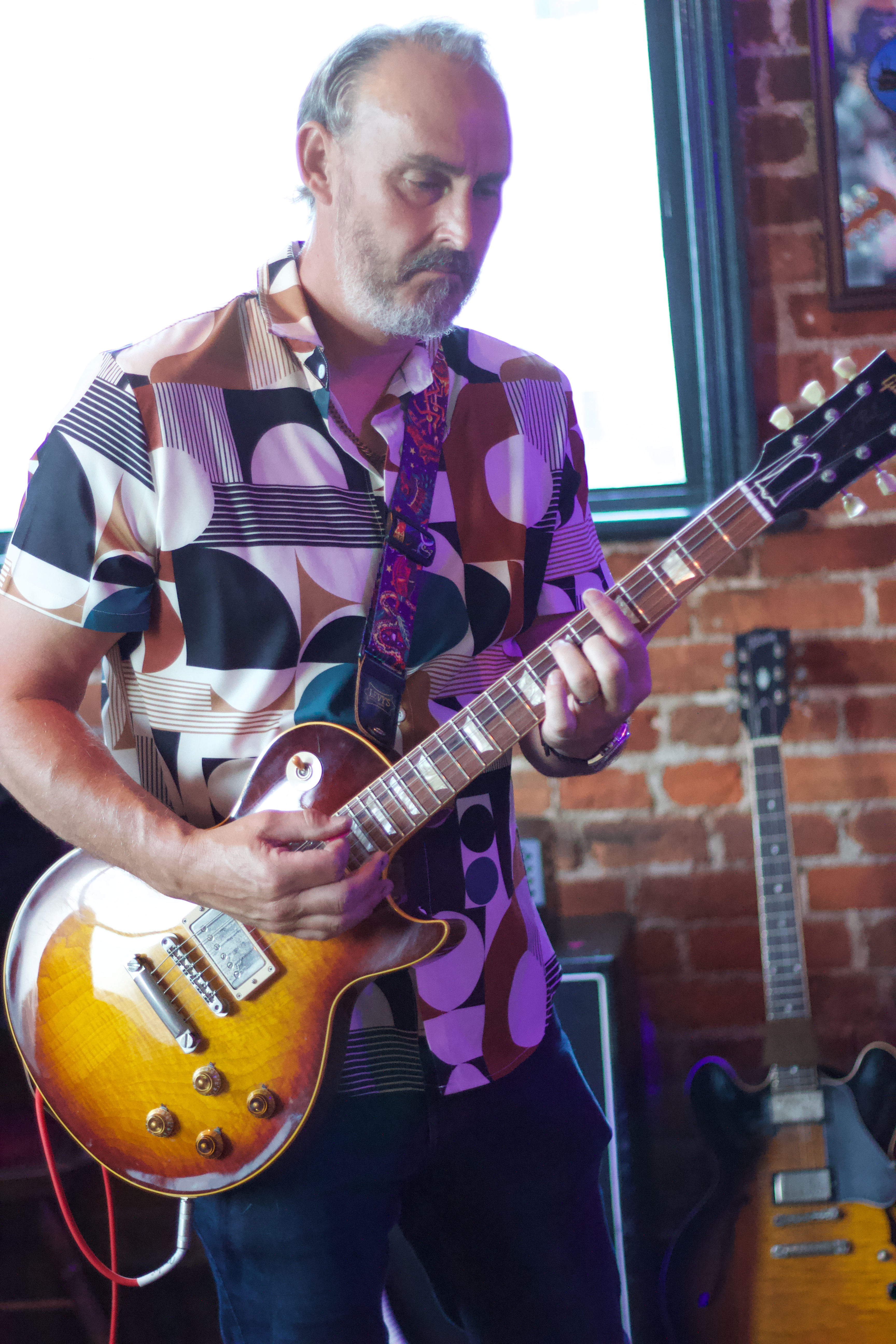 Steve Brennan of Chicago 9 performing live on guitar at the South Western Arms in Southampton during a Music Scene Magazine feature.