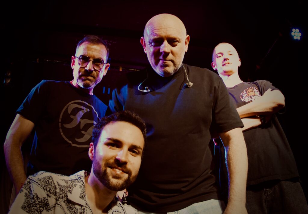 Members of Red Light Spies posing together on stage at The Stage Door in Southampton during the RSTE Promotions Launch Party, June 2026.